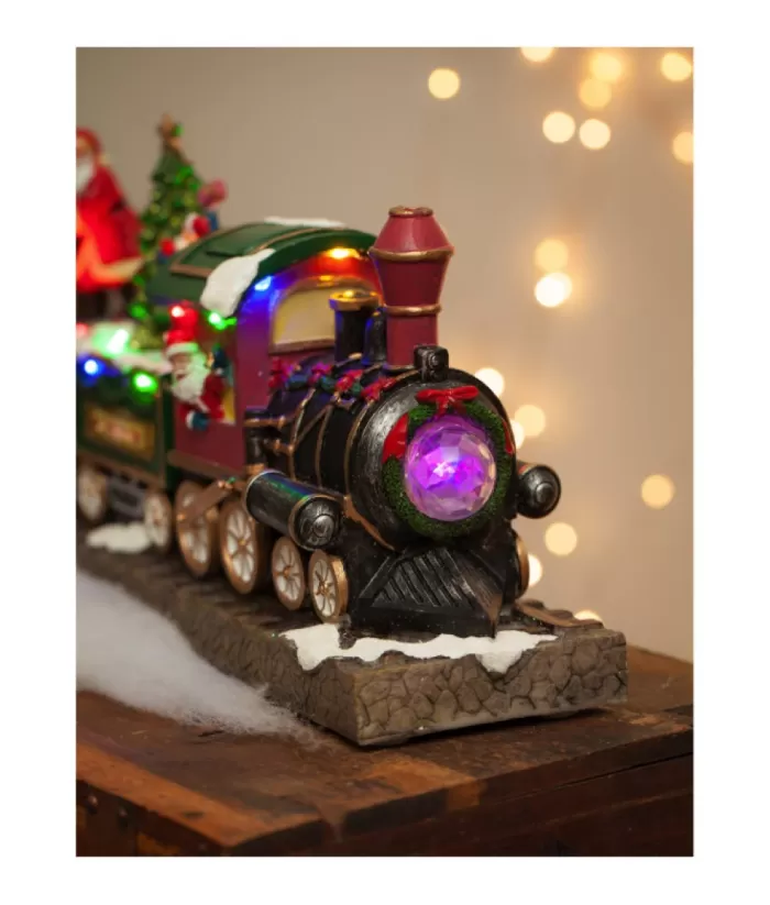 Boutique de Noël Animated And Musical Pieces*Table Ornament, Musical Train, With Santa And Elves. Measures 15 Inches.